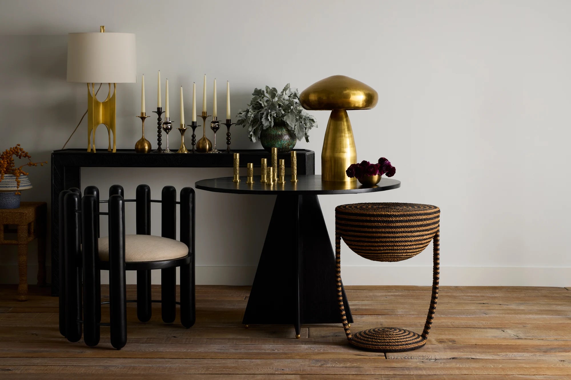Dining room with black and gold furniture, including a table and chairs.